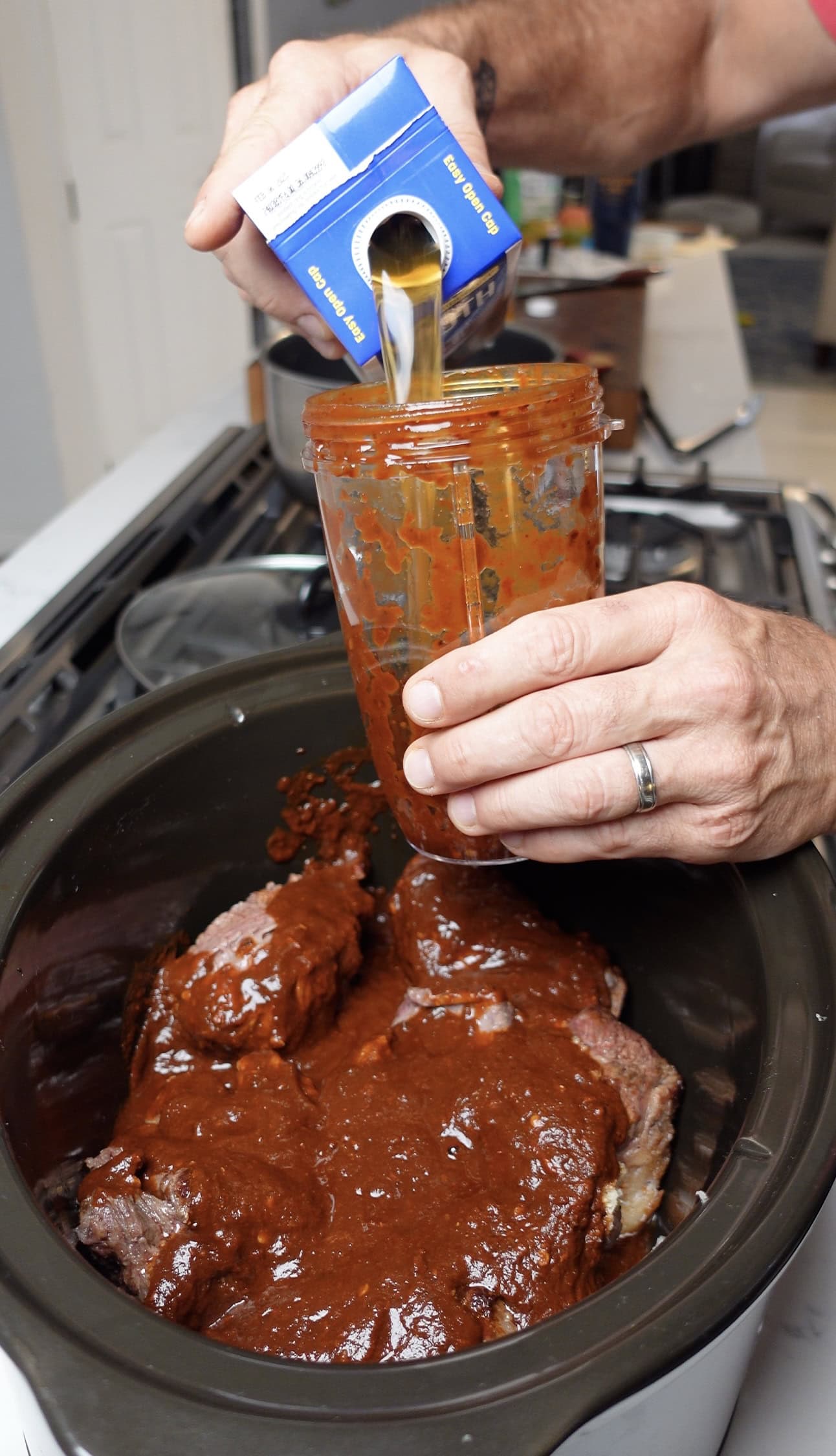 Broth going into a Crock Pot.